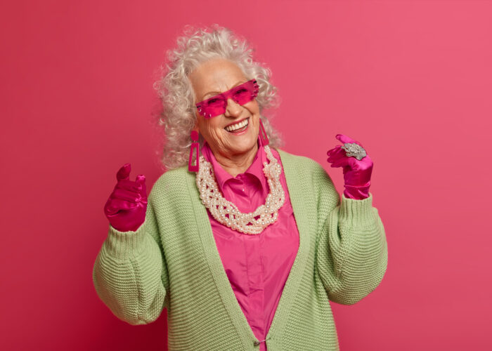 close up elegant elderly woman wearing stylish clothes isolated